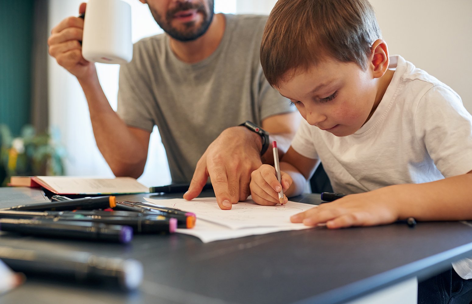 Father helping son with homework