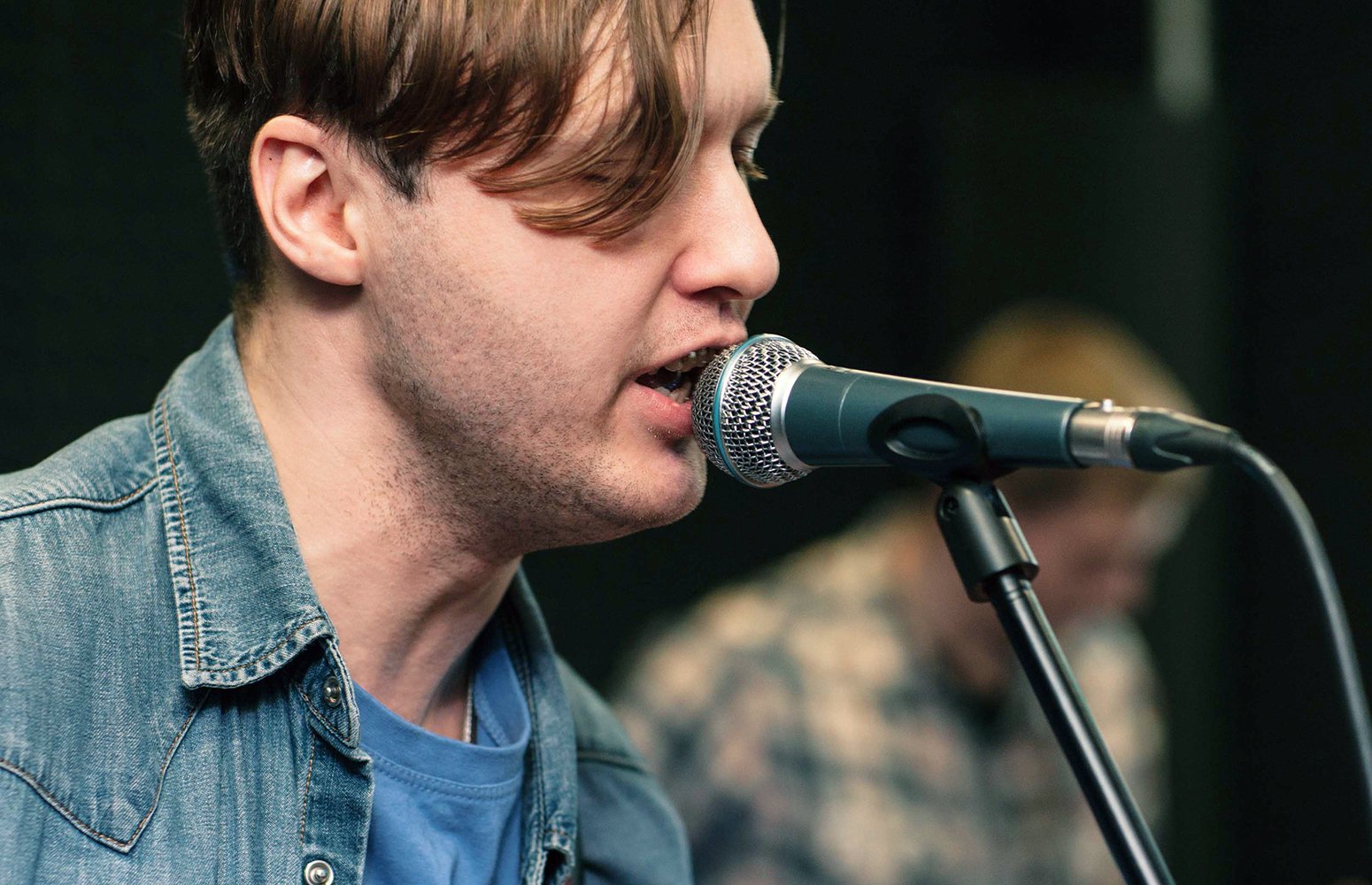 Man singing into microphone